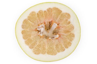 Half of a ripe pomelo fruit, top view of the cross section on a white background