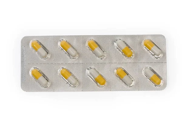 Blistr Balení Bílo Žluté Pilulky Farmaceutického Přípravku Bílém Pozadí Horní — Stock fotografie
