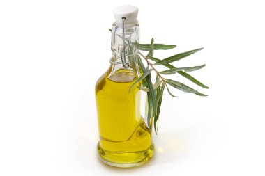 Küçük cam zeytin yağı şişesi. Kapağı kilitlenebilir. Zeytin dalı ve yapraklı.