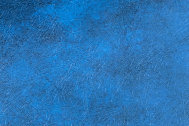 Kitabın sert kapağının bir parçası. Mavi malzemeyle yapılmış. Yakın plan, doku, arka plan gibi derileri taklit ediyor.