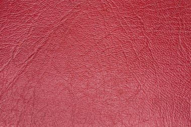 Kırmızıya boyanmış taklit deri dokusu, kullanılmış deri ürünün yakın plan, arka plan
