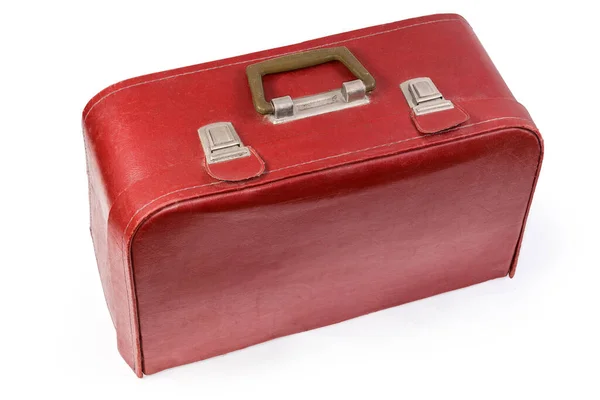 紧闭的老式硬壳行李箱 用红色皮革代替白色底座上的推杆 — 图库照片