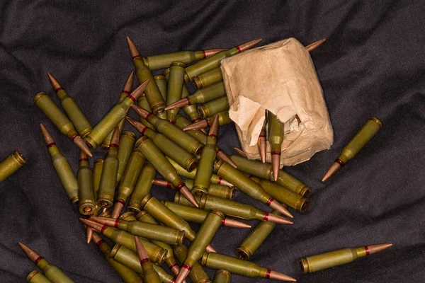 Paper Packaging Service Rifle Cartridges Heap Same Cartridges Black Textile — Stockfoto