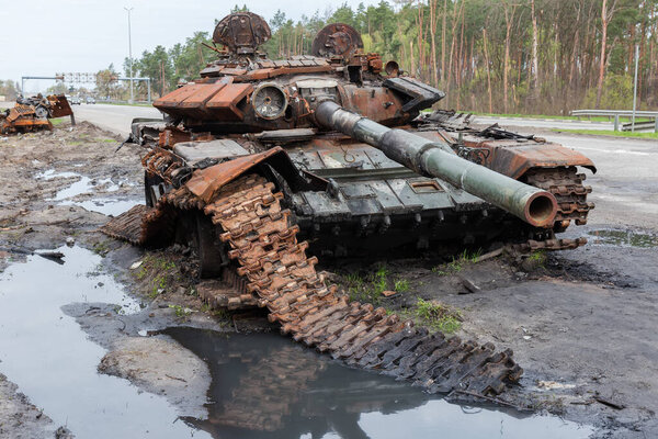 Russian battle tank which was destroyed on the roadside of highway during hostilities in Russian invasion of Ukraine, 2022
