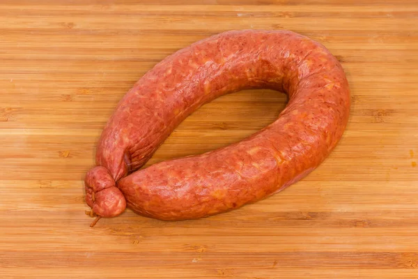 Whole Boiled Smoked Sausage Curtailed Ring Wooden Surface — Stock Photo, Image