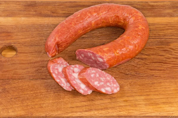 Partly Sliced Ring Boiled Smoked Sausage Wooden Cutting Board — Stock Photo, Image