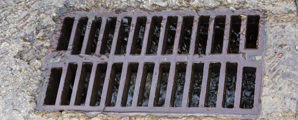 Cast Iron Grid Storm Drain Mounted Concrete Surface Flowing Rainwater — Stock fotografie