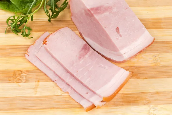 Partly Sliced Boiled Smoked Ham Skin Leaves Greens Wooden Cutting — Stock Photo, Image