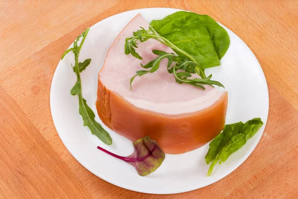 Piece Boiled Smoked Ham Skin Leaves Greens White Dish Wooden — Stockfoto
