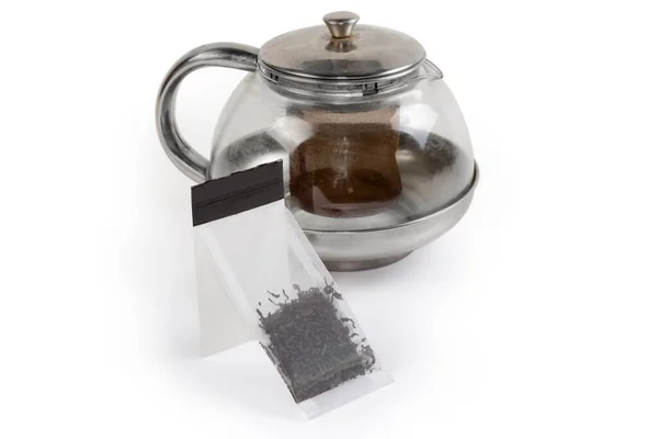 Beyaz Bir Yüzey Üzerindeki Cam Çaydanlığın Bulanık Arka Planına Yapıştırılmış — Stok fotoğraf