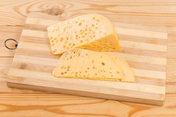 Partly Sliced Piece Swiss Type Cheese Bamboo Cutting Board Rustic —  Fotos de Stock