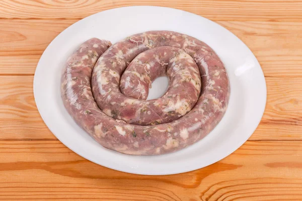 Coiled Raw Pork Sausage Herbs Natural Casing Dish Rustic Table — Stock fotografie