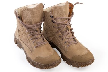 Pair of the beige waterproofed leather summer combat boots on shoelaces on a white background