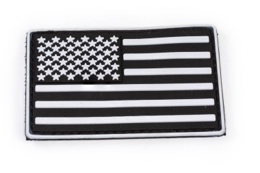 Vinyl US flag sticker in black and white color scheme with hook-and-loop fastener close-up on a white background
