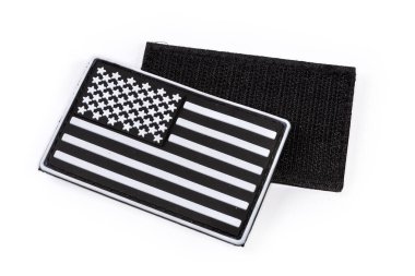 Pair of the vinyl US flag sticker in black and white color scheme with hook-and-loop fastener close-up on a white background