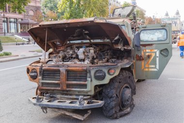 Kyiv, Ukraine - August 22, 2022: Exposition of Russian military equipment destroyed in Russian invasion of Ukraine, wrecked armoured combat vehicle clipart