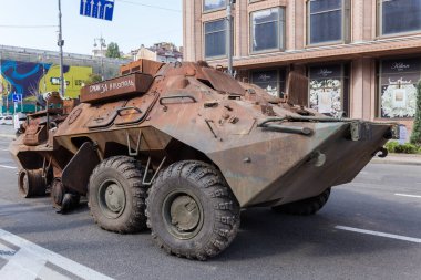 Kyiv, Ukraine - August 22, 2022: Exposition of Russian military equipment destroyed in Russian invasion of Ukraine, wrecked burnt rusty armored personnel carrier
