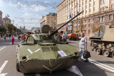 Kyiv, Ukraine - August 22, 2022: Exposition of Russian military equipment destroyed during hostilities in Russian invasion of Ukraine, general view on a background of the different buildings
