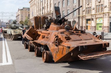 Kyiv, Ukraine - August 22, 2022: Exposition of Russian military equipment destroyed in Russian invasion of Ukraine, wrecked burnt rusty armored personnel carrier