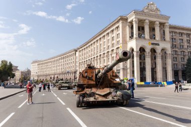 Kyiv, Ukraine - August 22, 2022: Exposition of Russian military equipment destroyed during hostilities in Russian invasion of Ukraine, general view on a background of the different buildings