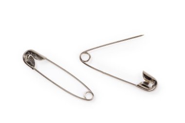 One open and one closed metal safety pins, top view close-up on a white background