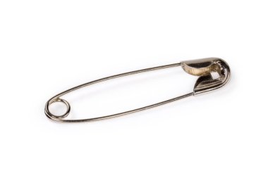 Single closed metal safety pin close-up on a white background