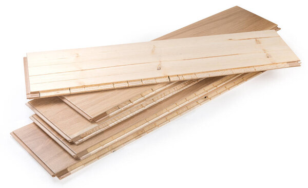 Stack of the three-layer engineered wood flooring boards with white oak face layer, pine core layer and glue-less locking joint system, top board turned face down on a white background