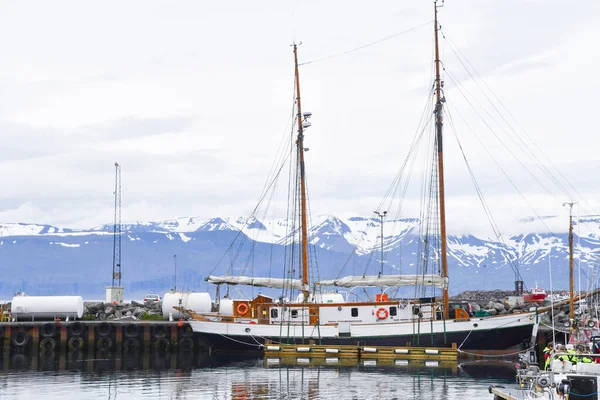 Two-masted whale watching sailboat stops at Husavik Port in northern Iceland - Europe