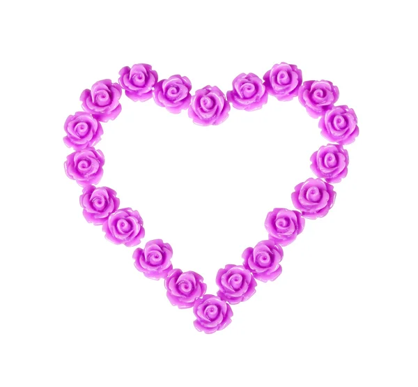 Plastic roses in heart shape — Stock Photo, Image