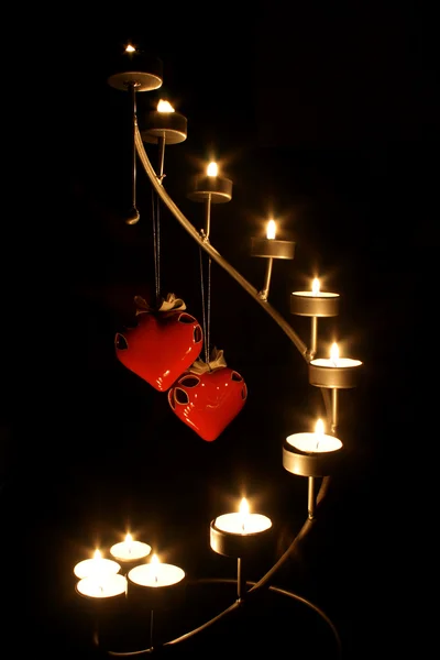 Dos corazones a la luz de las velas — Foto de Stock