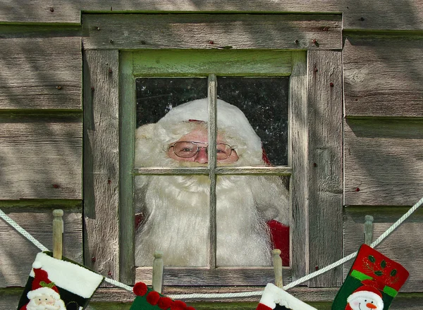 Weihnachtsmann mit Strümpfen — Stockfoto