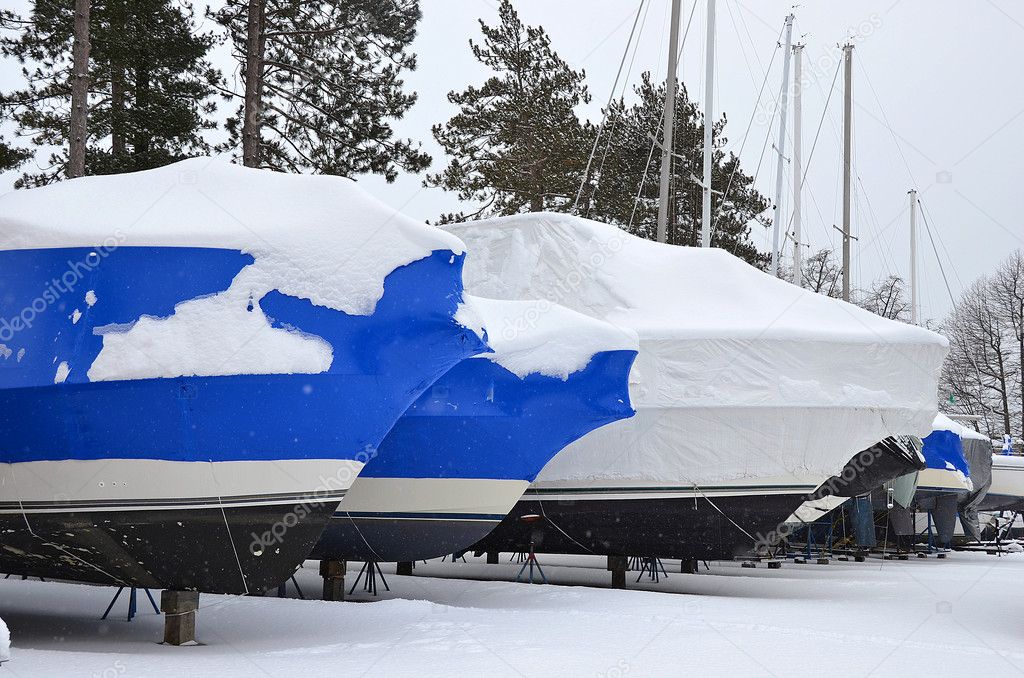 shrink wrapped boats in snow