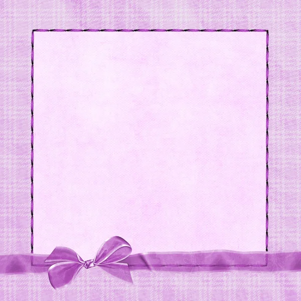 Pink bow on plaid frame — Stock Photo, Image