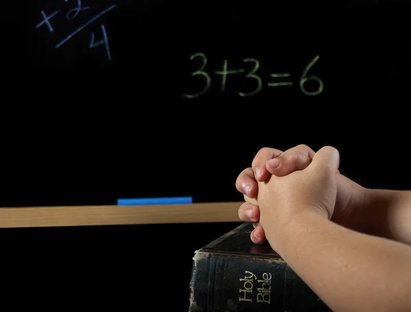 Child praying in school — Stock Photo, Image