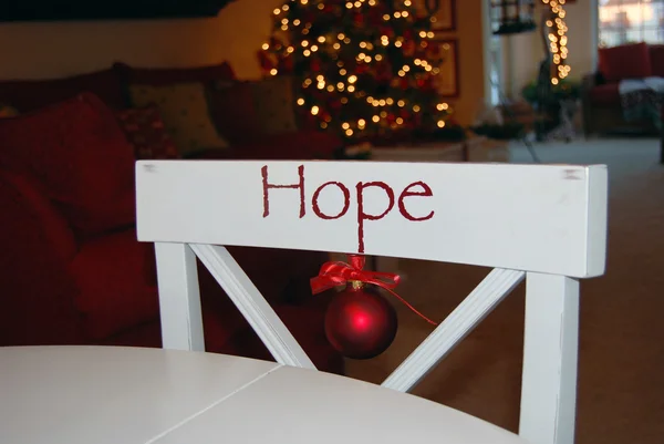 Christmas ornament on white chair — Stock Photo, Image