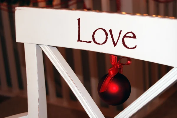 Christmas ornament on kitchen chair — Stock Photo, Image