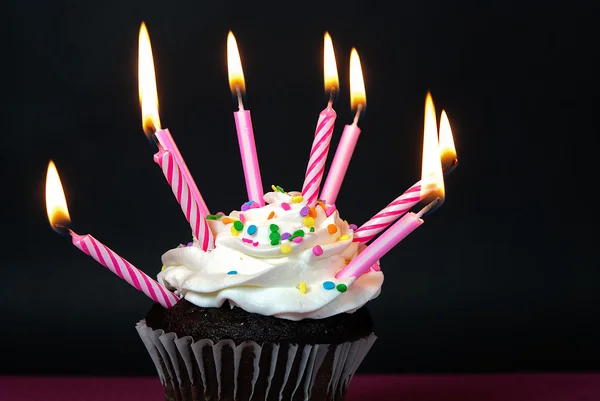 Many pink candles on cupcake — Stock Photo, Image