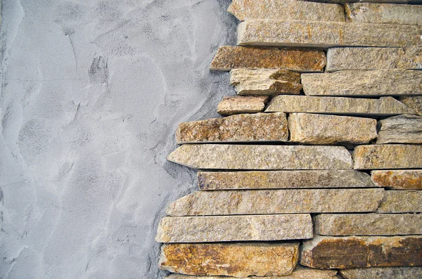 Песчаник и цементная стена — стоковое фото