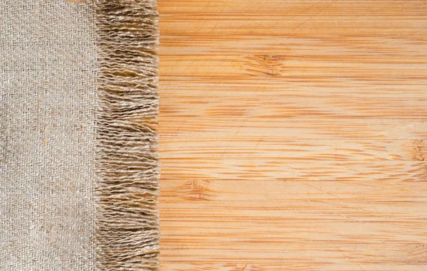 Een rouwgewaad en hout textuur — Stockfoto