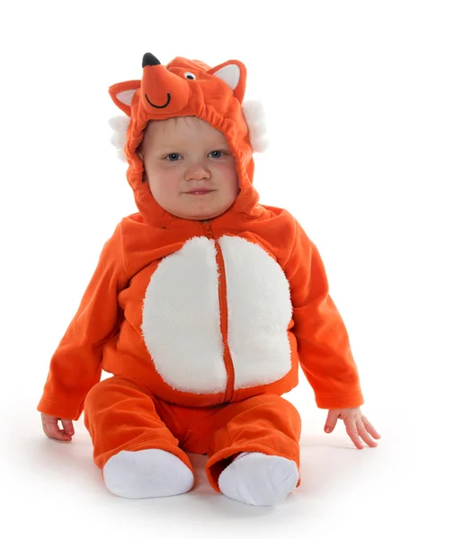 Baby boy in fox costume looking at camera on white Stock Photo by