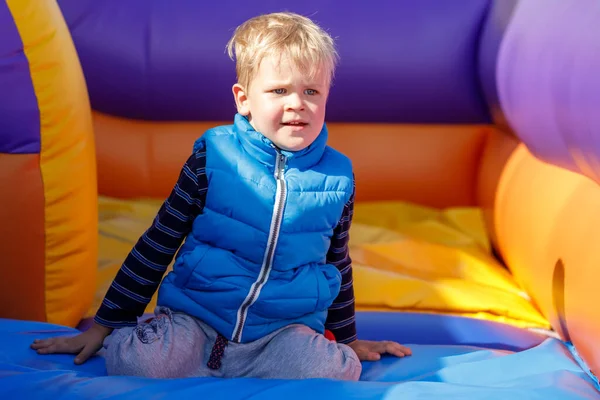 Portrait Little Boy Wearing Blue Vest Colorful Striped Trampoline Child — Stock Photo, Image