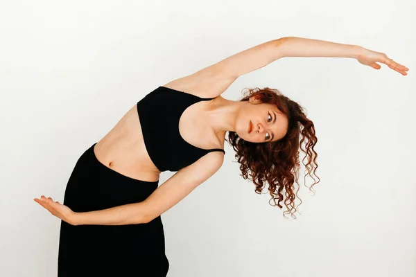 Modern Redhead Yoga Instructor Black Top Black Long Skirt Stretching — Stock Photo, Image