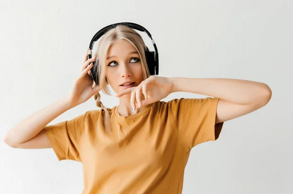 Attractive Young Woman Listening Music Headphones Wearing Yellow Shirt White — Zdjęcie stockowe