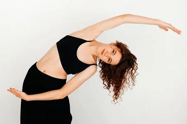 Modern Redhead Yoga Instructor Black Top Black Long Skirt Stretching — Stock Photo, Image