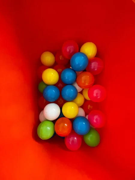 Colorful Plastic Toy Balls Red Container — Stock Photo, Image