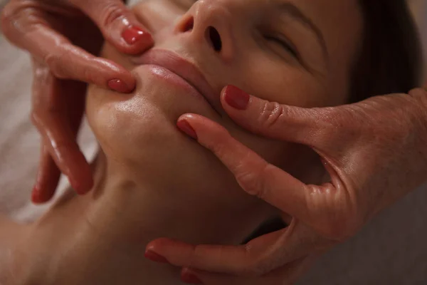 Cropped Close Professional Beautician Doing Face Lifting Massage Mature Woman — Stock Photo, Image
