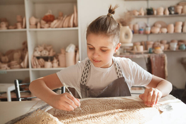 Young vute boy enjoying pottery class at rt studio