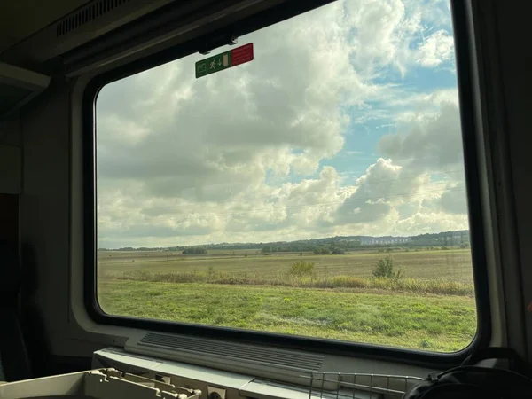 Stunning fields scenery in the window of a train