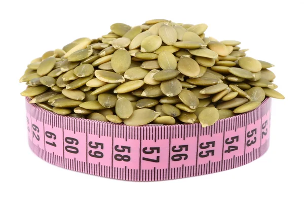 Shelled pumpkin seed and meter — Stock Photo, Image