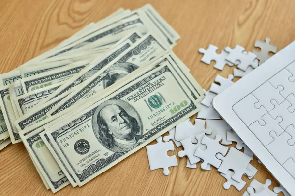 Dollar Banknotes Puzzle Pieces Wooden Background Stock Image